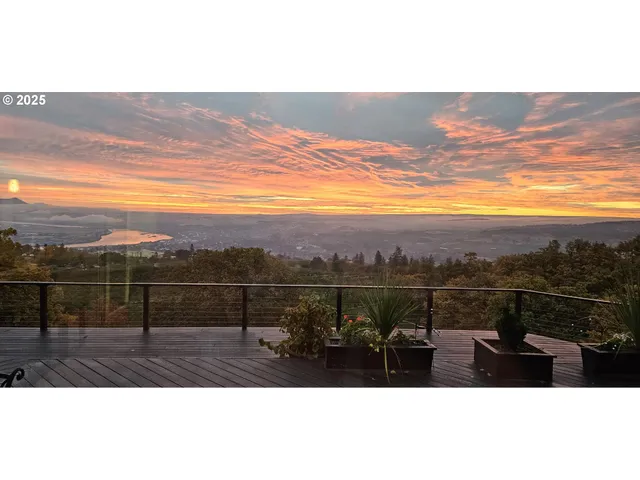 a view of city and mountain from a balcony