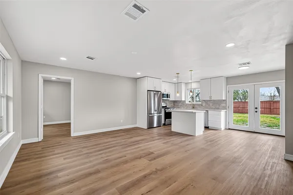 a view of kitchen with wooden floor