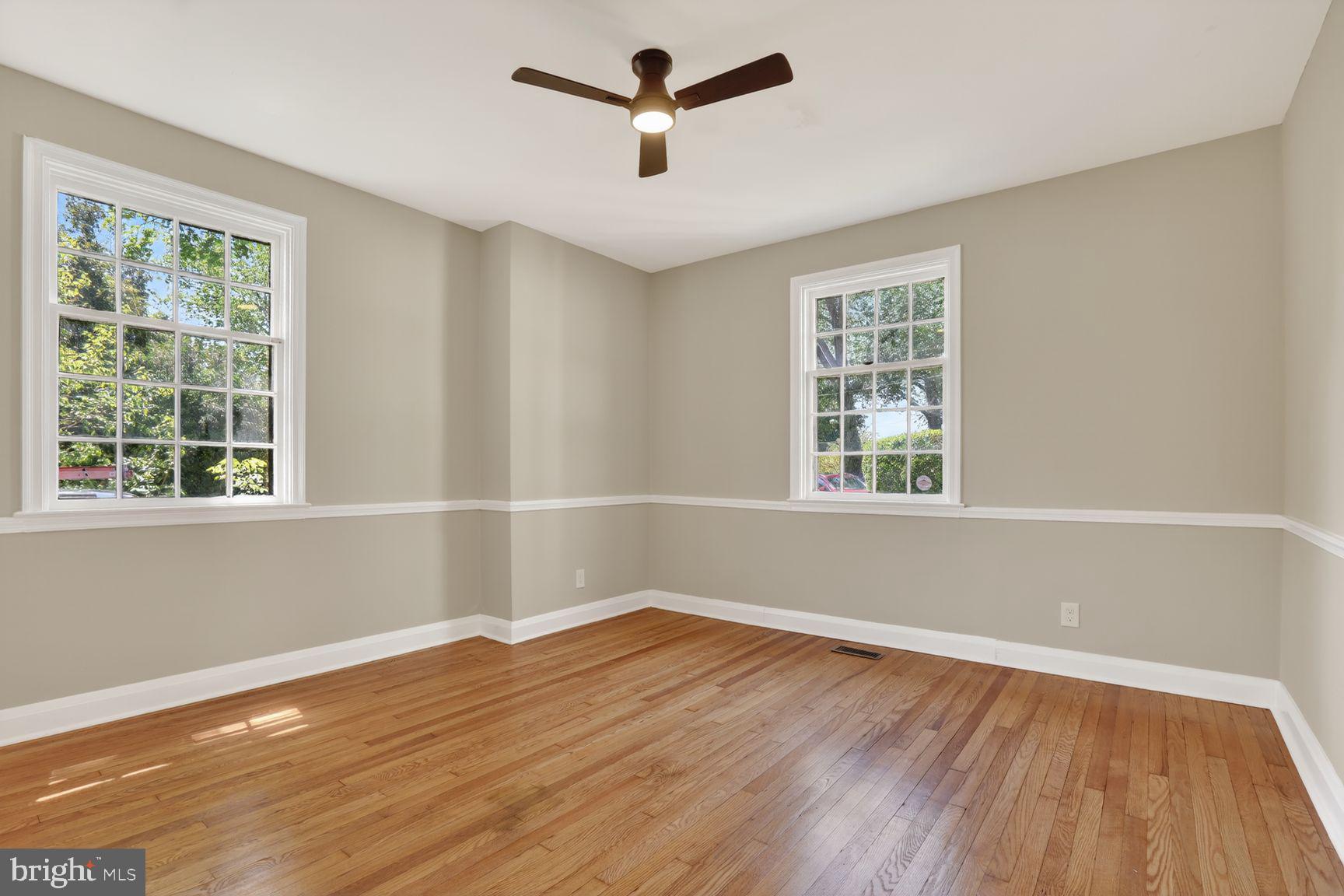 315 East Cold Spring Lane Baltimore, MD 21212 - Photo 24 of 25 a view of empty room with wooden floor and fan
