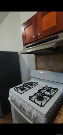 a kitchen with a stove and a microwave
