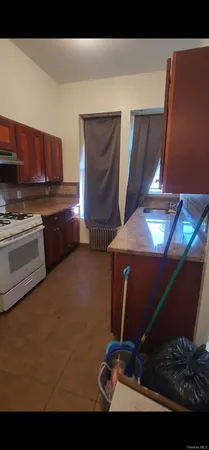 a kitchen with a sink cabinets and appliances