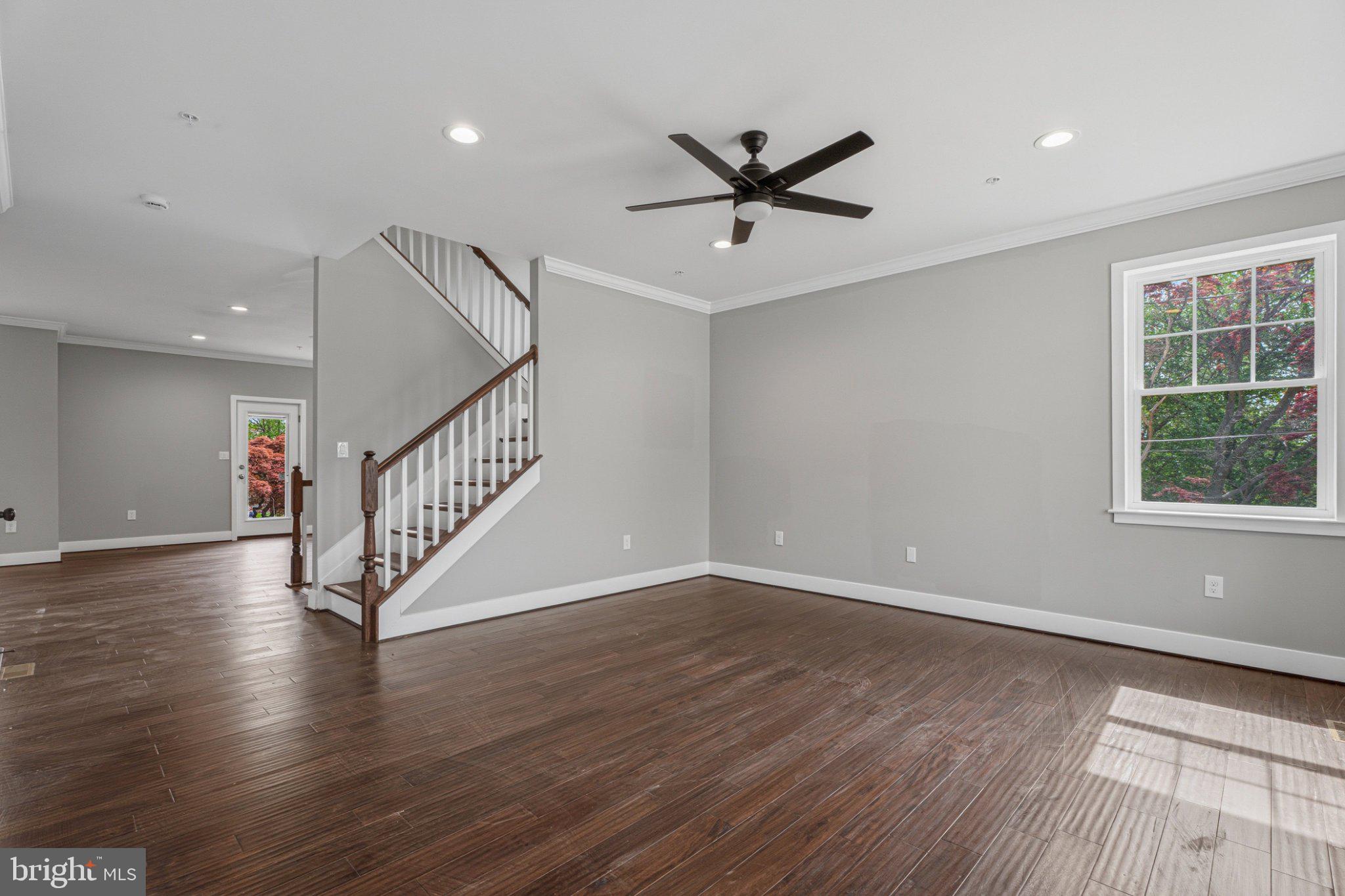 4100 Taylor Avenue Baltimore, MD 21236 - Photo 11 of 57 a view of empty room with wooden floor and fan
