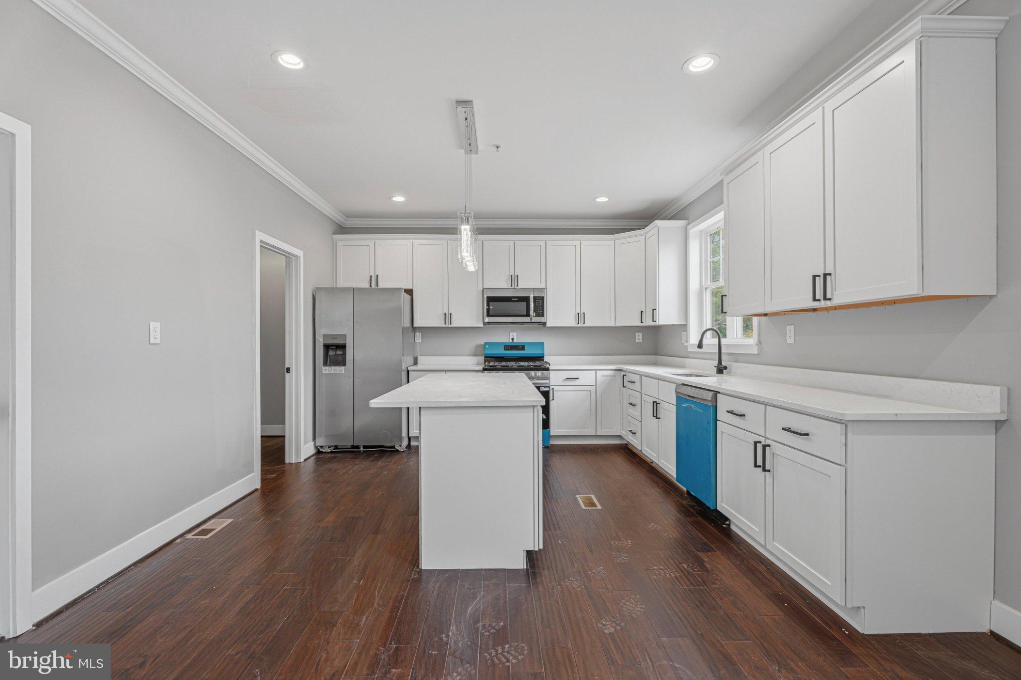 4100 Taylor Avenue Baltimore, MD 21236 - Photo 14 of 57 a kitchen with a refrigerator a sink and cabinets