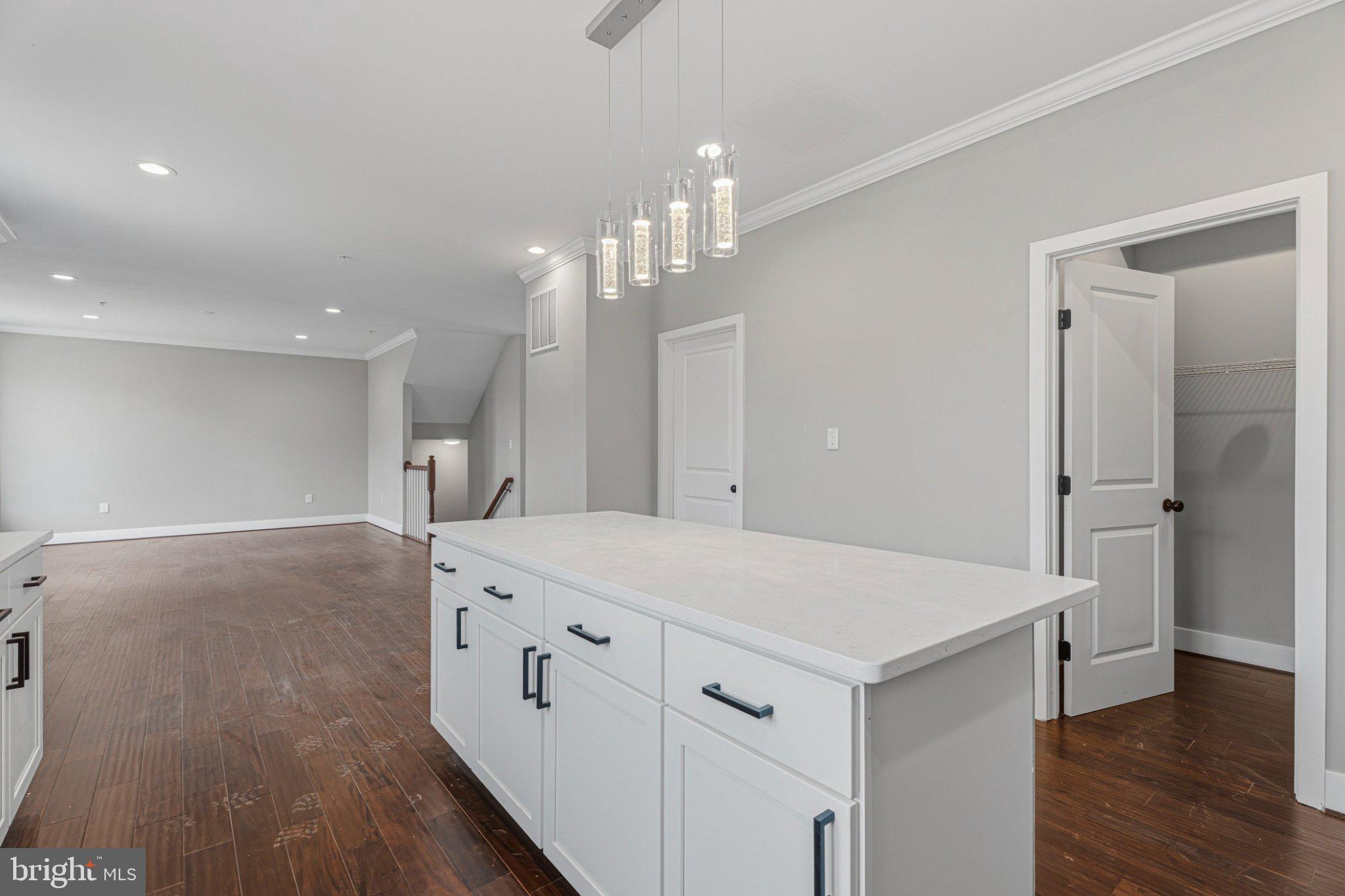 4100 Taylor Avenue Baltimore, MD 21236 - Photo 16 of 57 a view of a kitchen island wooden floor