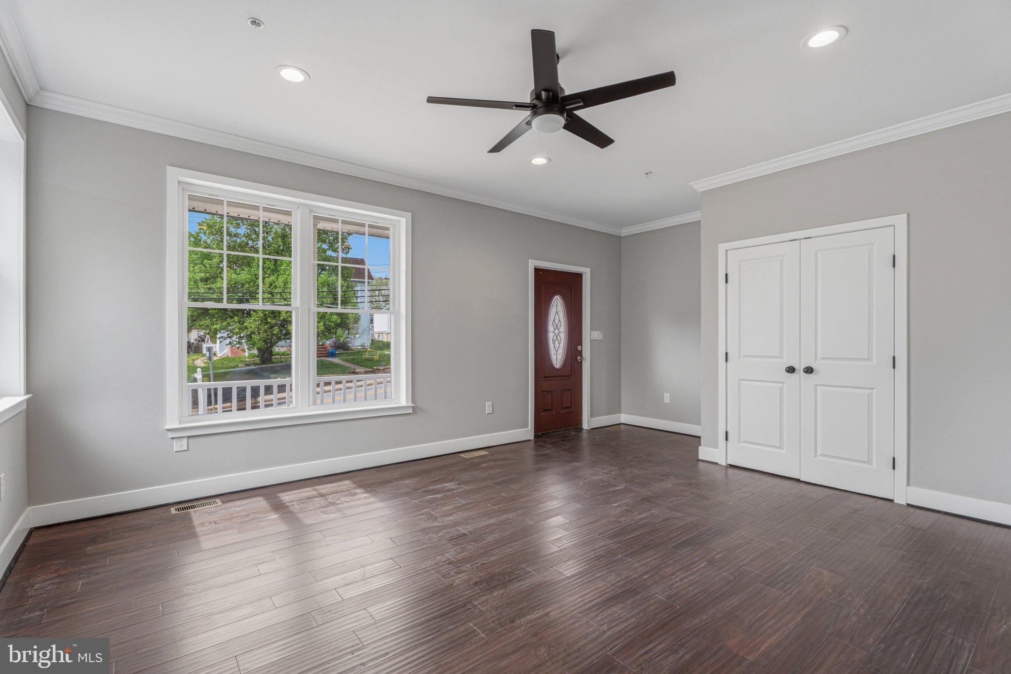 4100 Taylor Avenue Baltimore, MD 21236 - Photo 19 of 57 a view of an empty room with a window and wooden floor