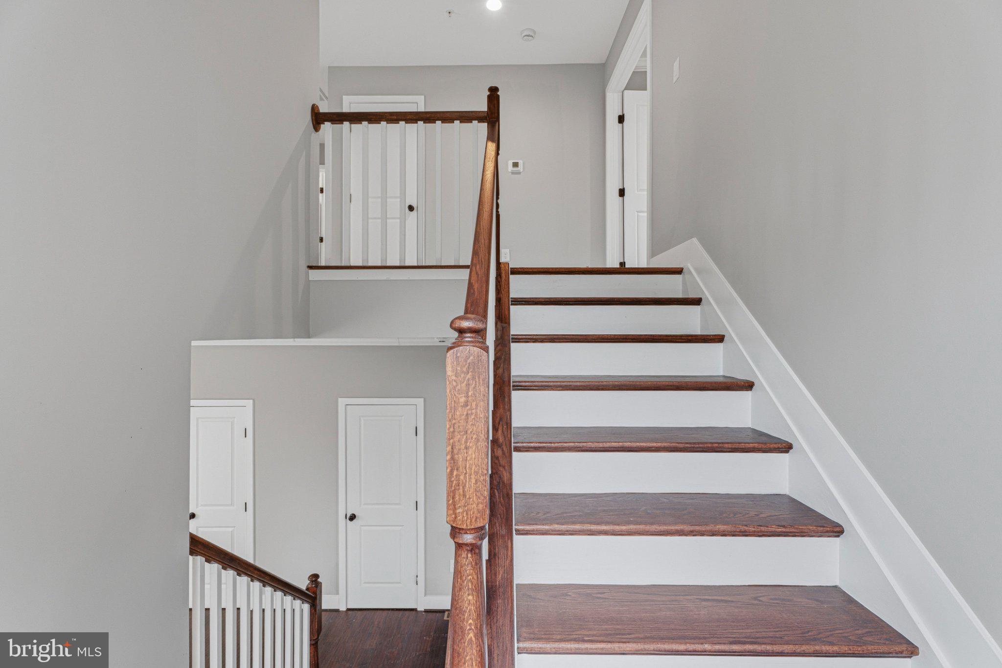 4100 Taylor Avenue Baltimore, MD 21236 - Photo 20 of 57 a view of staircase with white walls and a window