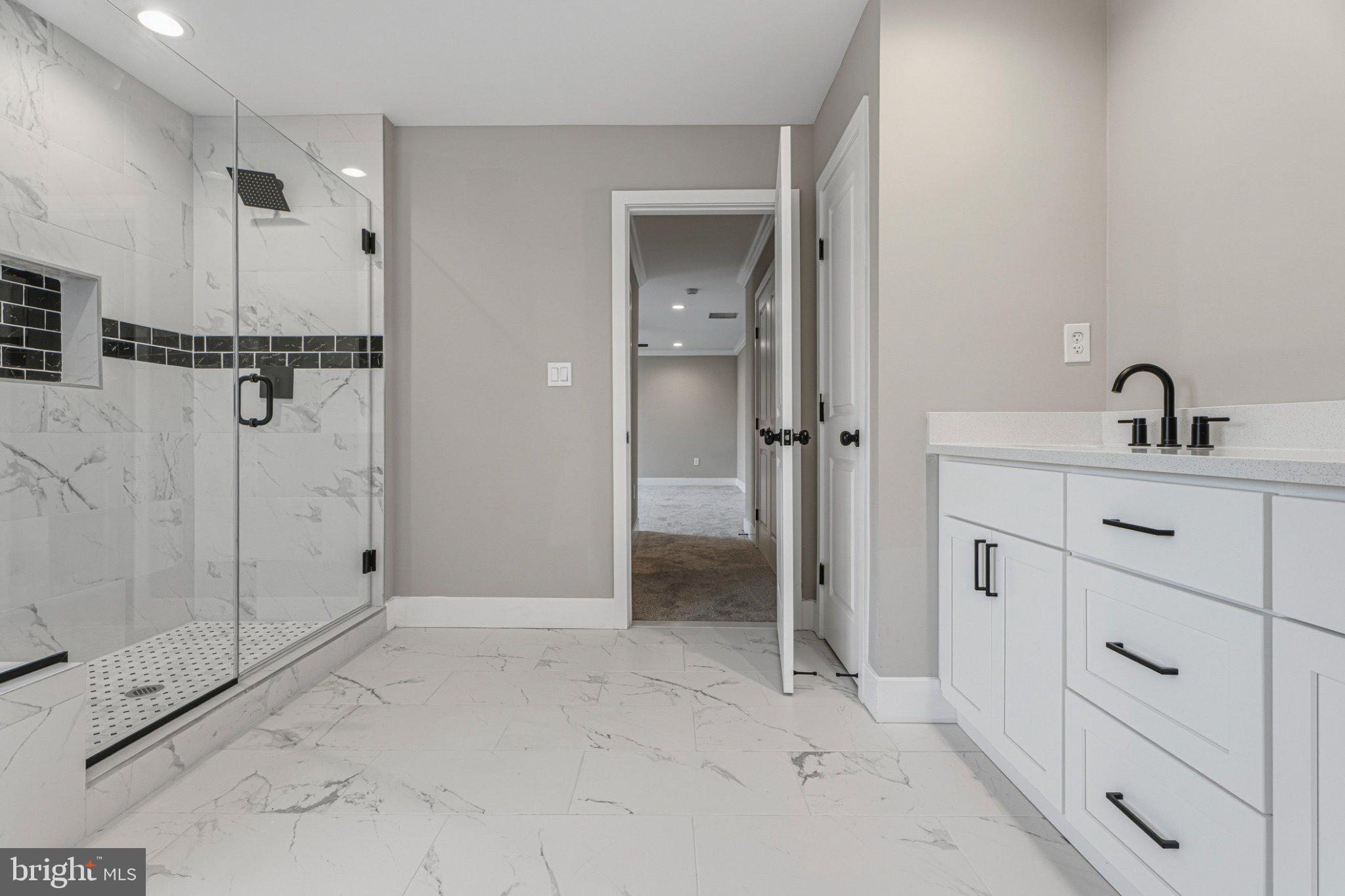 4100 Taylor Avenue Baltimore, MD 21236 - Photo 29 of 57 a bathroom with a sink and shower