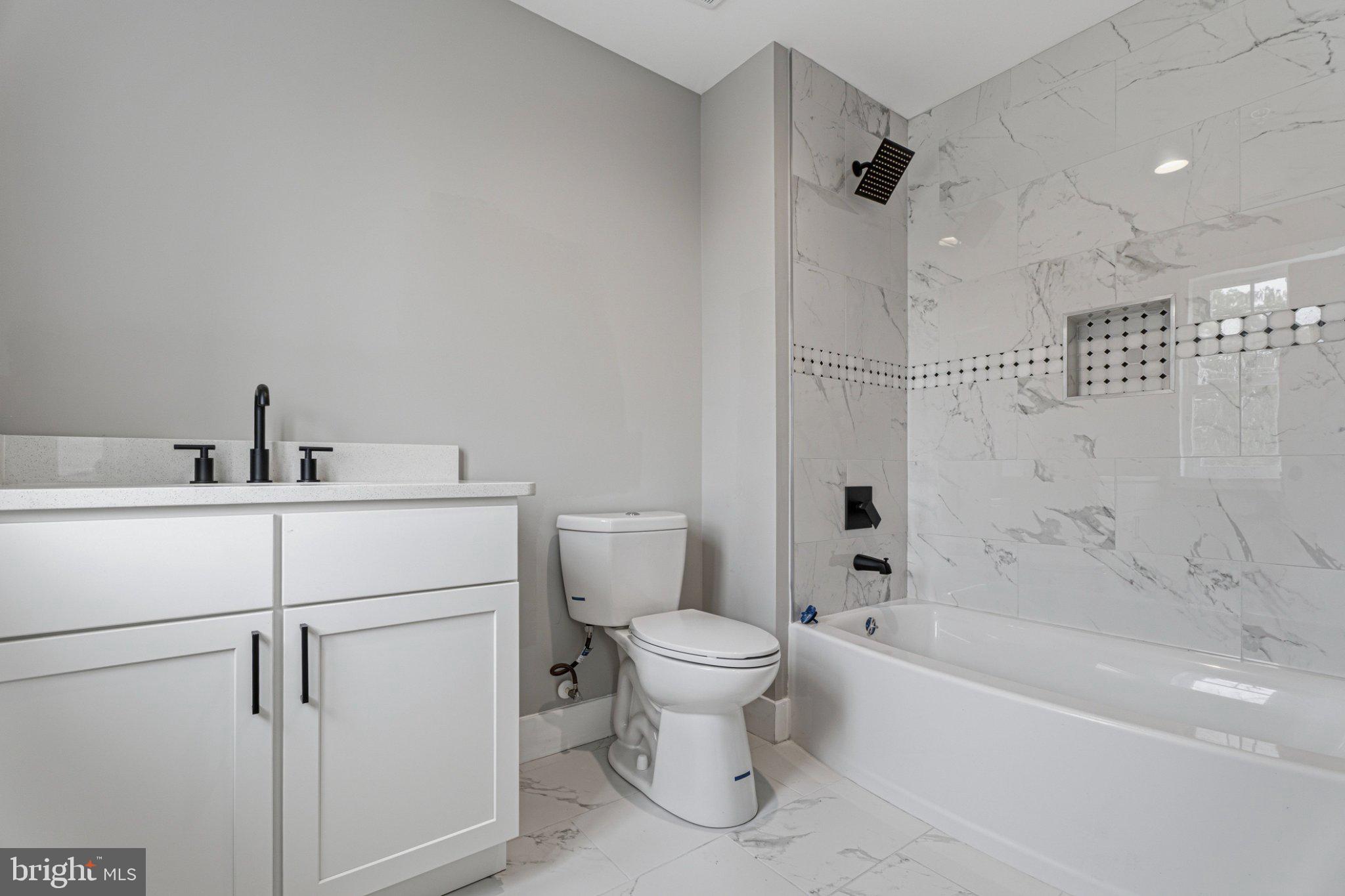 4100 Taylor Avenue Baltimore, MD 21236 - Photo 35 of 57 a bathroom with a toilet sink and shower