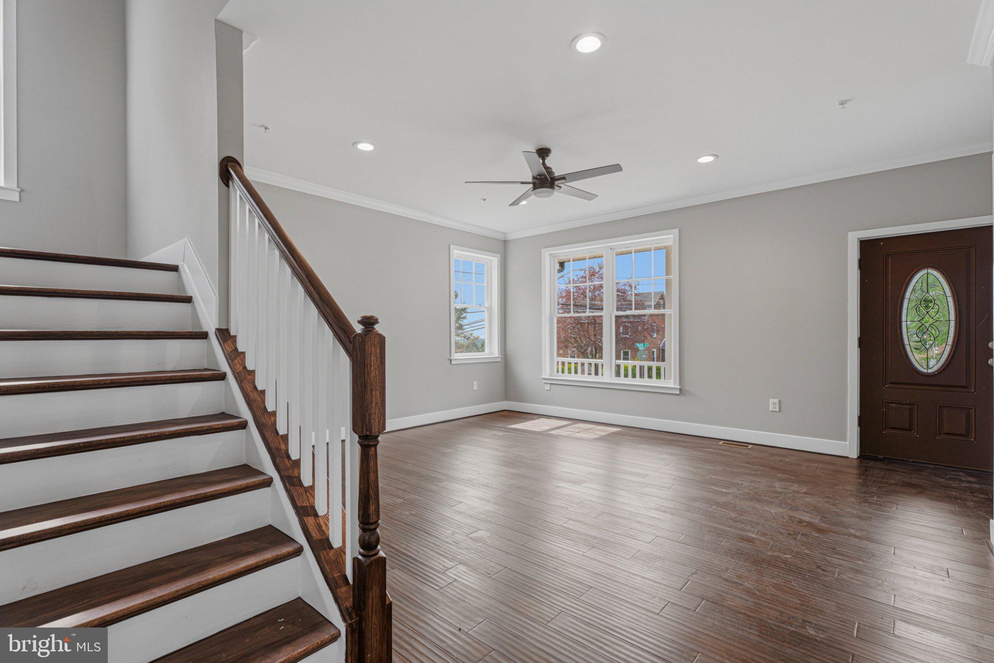 4100 Taylor Avenue Baltimore, MD 21236 - Photo 4 of 57 a view of an empty room with wooden floor and window