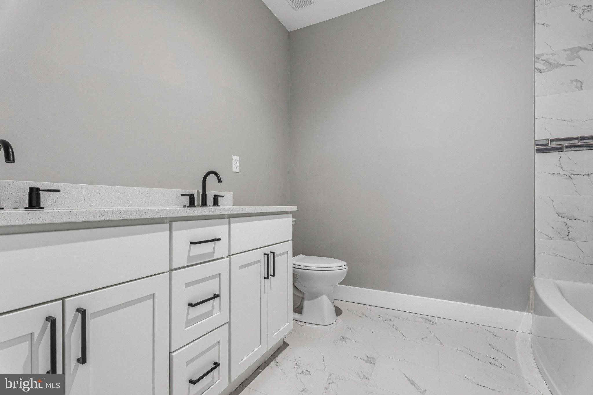 4100 Taylor Avenue Baltimore, MD 21236 - Photo 42 of 57 a bathroom with a sink toilet and vanity