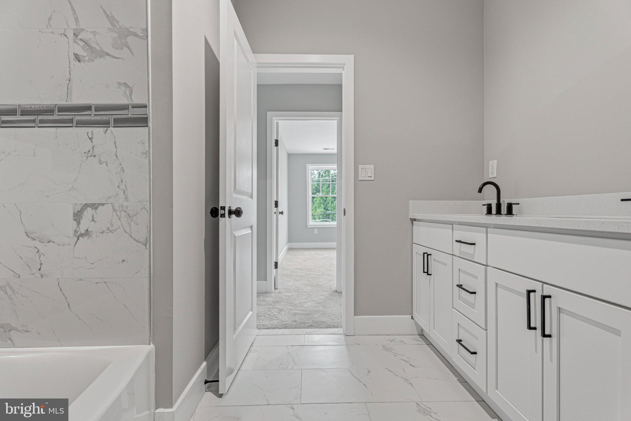 4100 Taylor Avenue Baltimore, MD 21236 - Photo 43 of 57 Modern elegance in a serene bathroom.