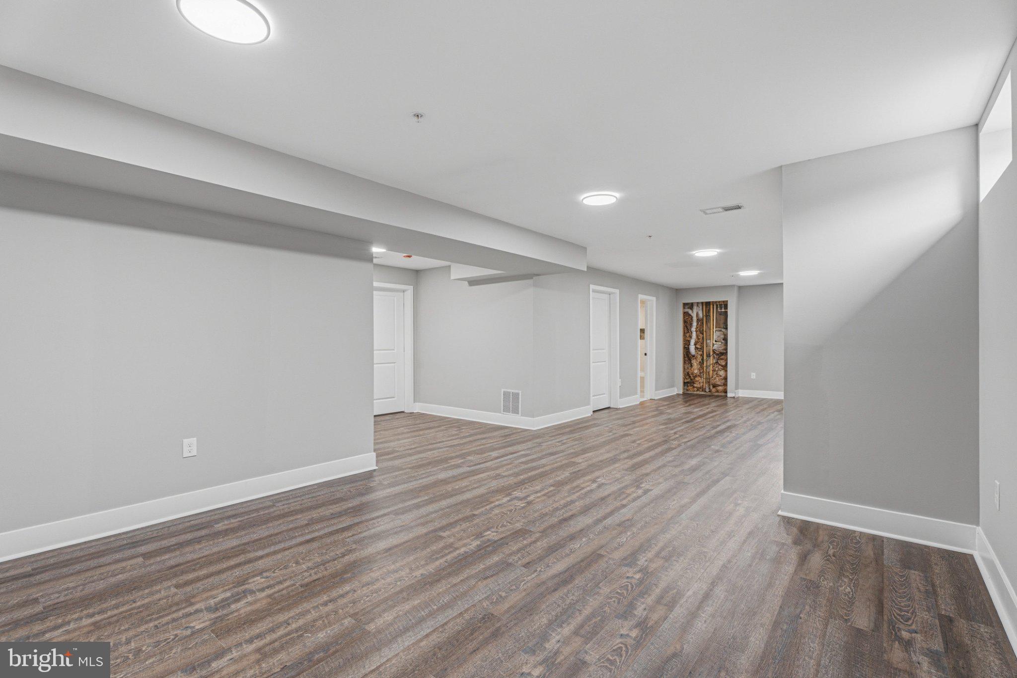 4100 Taylor Avenue Baltimore, MD 21236 - Photo 49 of 57 a view of an empty room with wooden floor