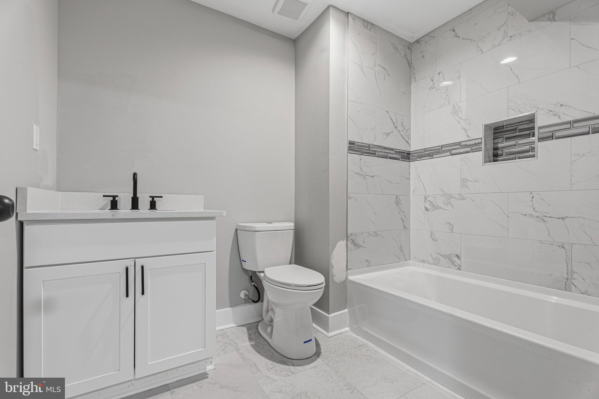 4100 Taylor Avenue Baltimore, MD 21236 - Photo 51 of 57 a bathroom with a sink toilet and shower