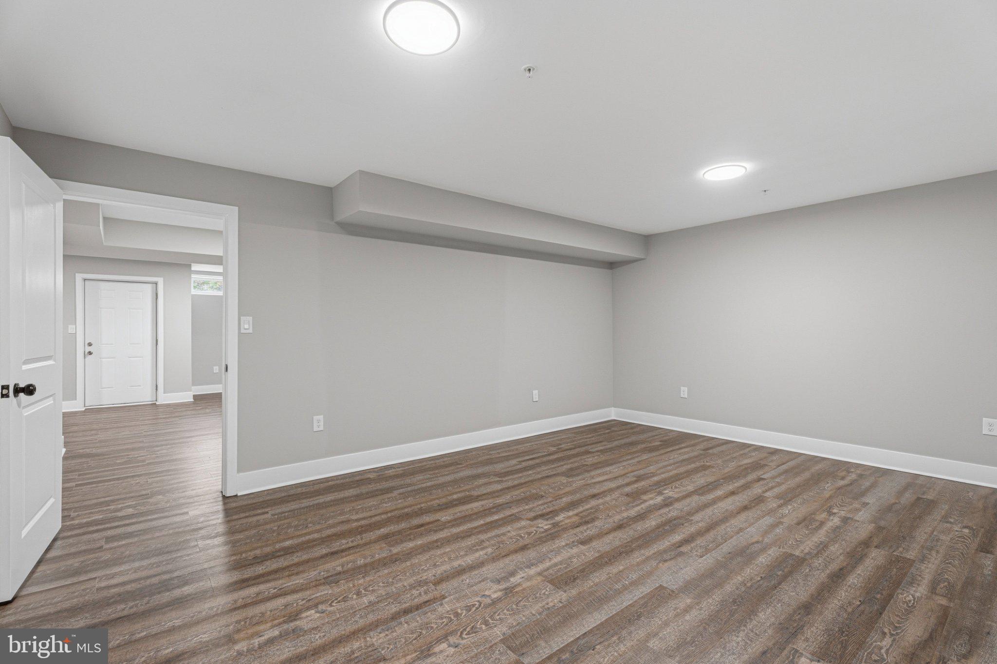 4100 Taylor Avenue Baltimore, MD 21236 - Photo 54 of 57 wooden floor in an empty room with a window