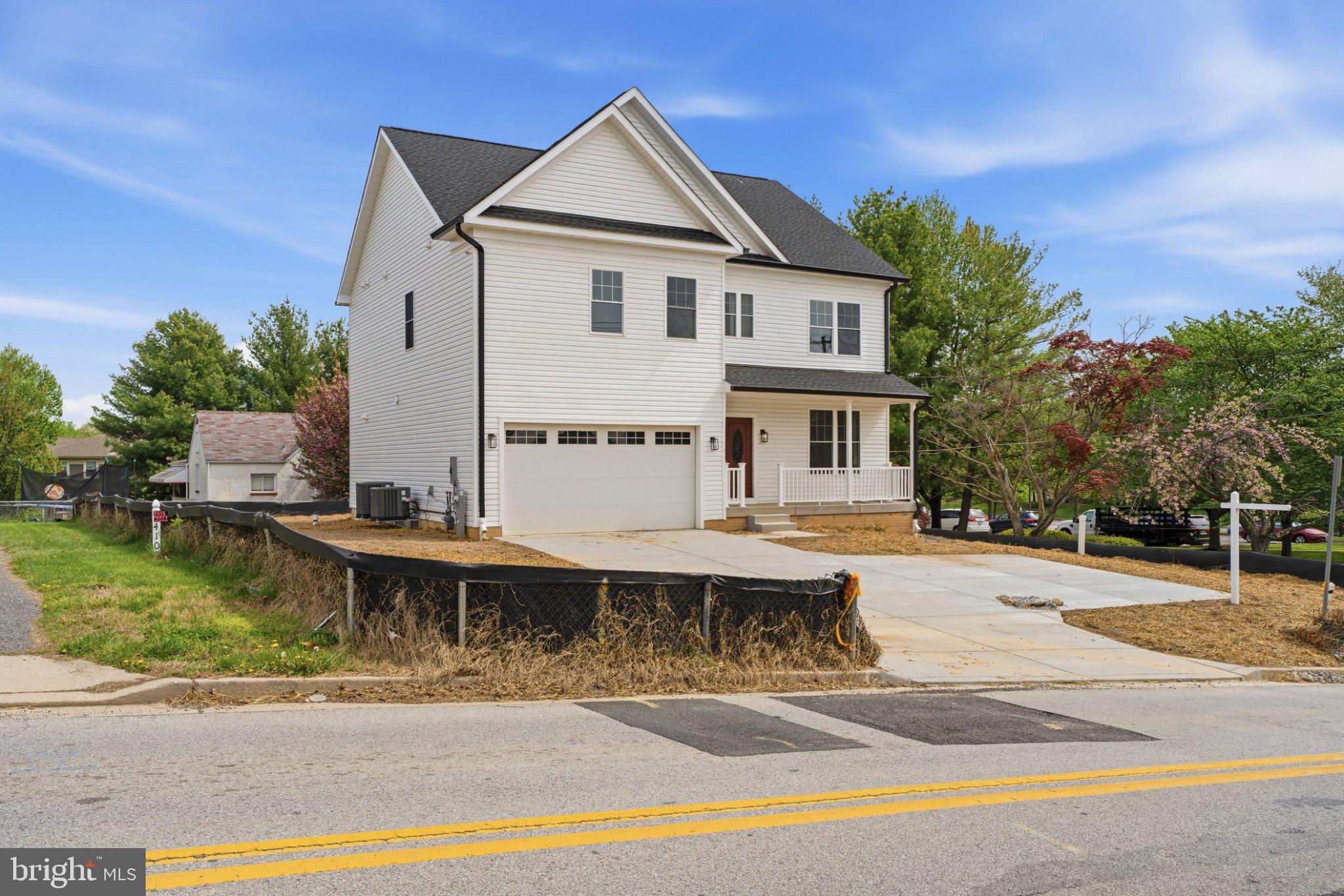 4100 Taylor Avenue Baltimore, MD 21236 - Photo 55 of 57 a front view of a house with a yard