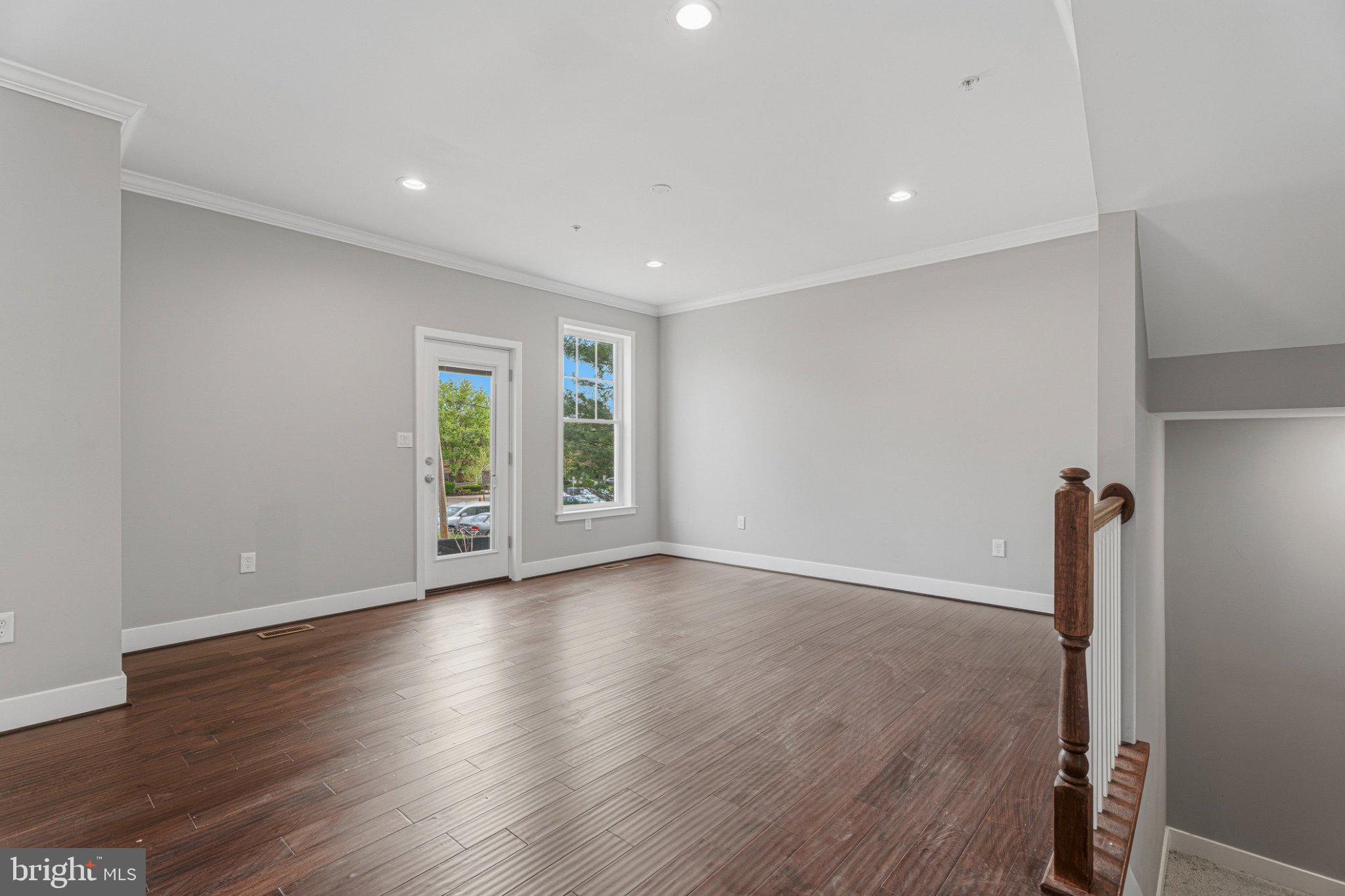 4100 Taylor Avenue Baltimore, MD 21236 - Photo 7 of 57 a view of empty room with wooden floor and fan