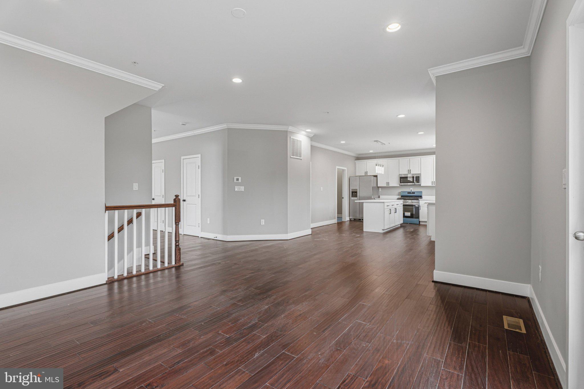 4100 Taylor Avenue Baltimore, MD 21236 - Photo 9 of 57 a view of a hallway with wooden floor