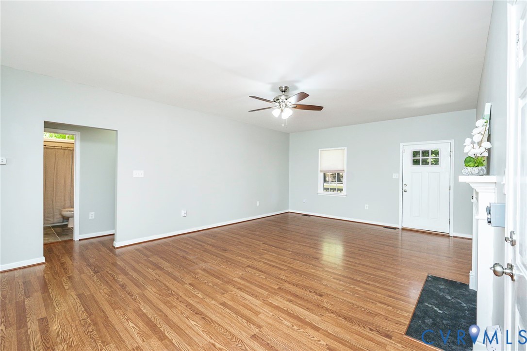 1297 Manfield Road Aylett, VA 23009 - Photo 24 of 41 a view of an empty room with wooden floor