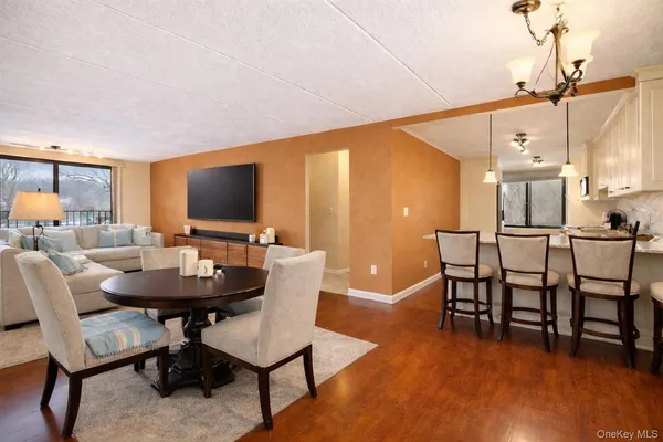 a view of a livingroom with furniture and a flat screen tv