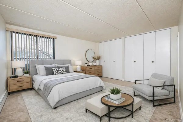 a bedroom with a bed and a couch