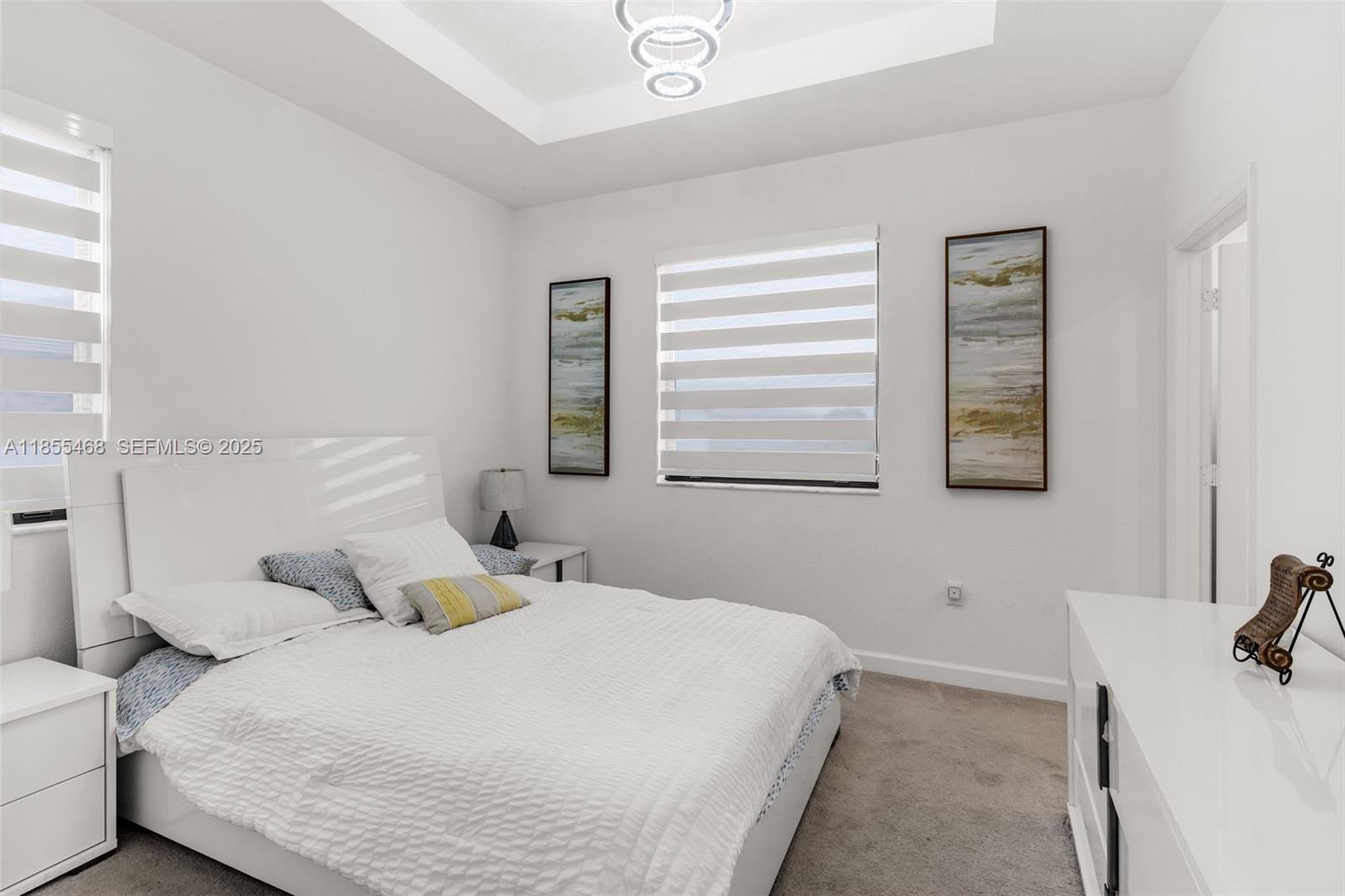 13315 Southwest 285th Street Homestead, FL 33033 - Photo 13 of 31 a bedroom with a bed and a window