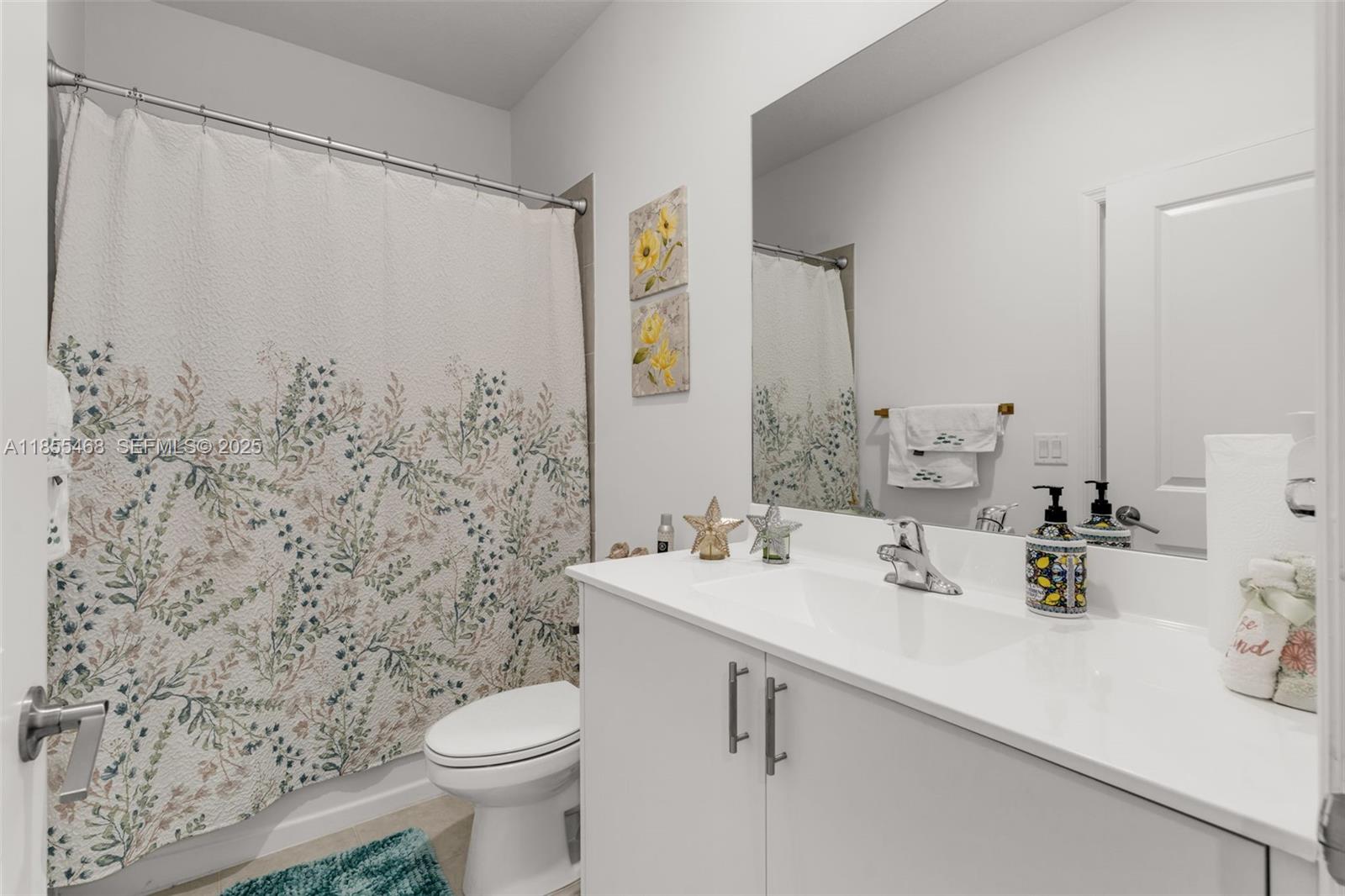 13315 Southwest 285th Street Homestead, FL 33033 - Photo 17 of 31 a bathroom with a sink toilet and shower