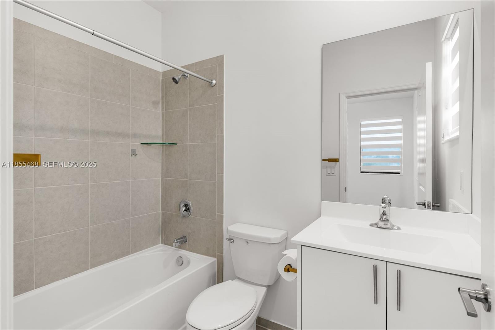 13315 Southwest 285th Street Homestead, FL 33033 - Photo 8 of 31 a bathroom with a sink toilet and shower