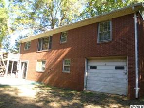 13936 Shopton Road West Charlotte, NC 28278 - Photo 2 of 16 a view of a house with a yard