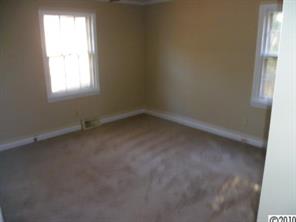 13936 Shopton Road West Charlotte, NC 28278 - Photo 5 of 16 an empty room with a window