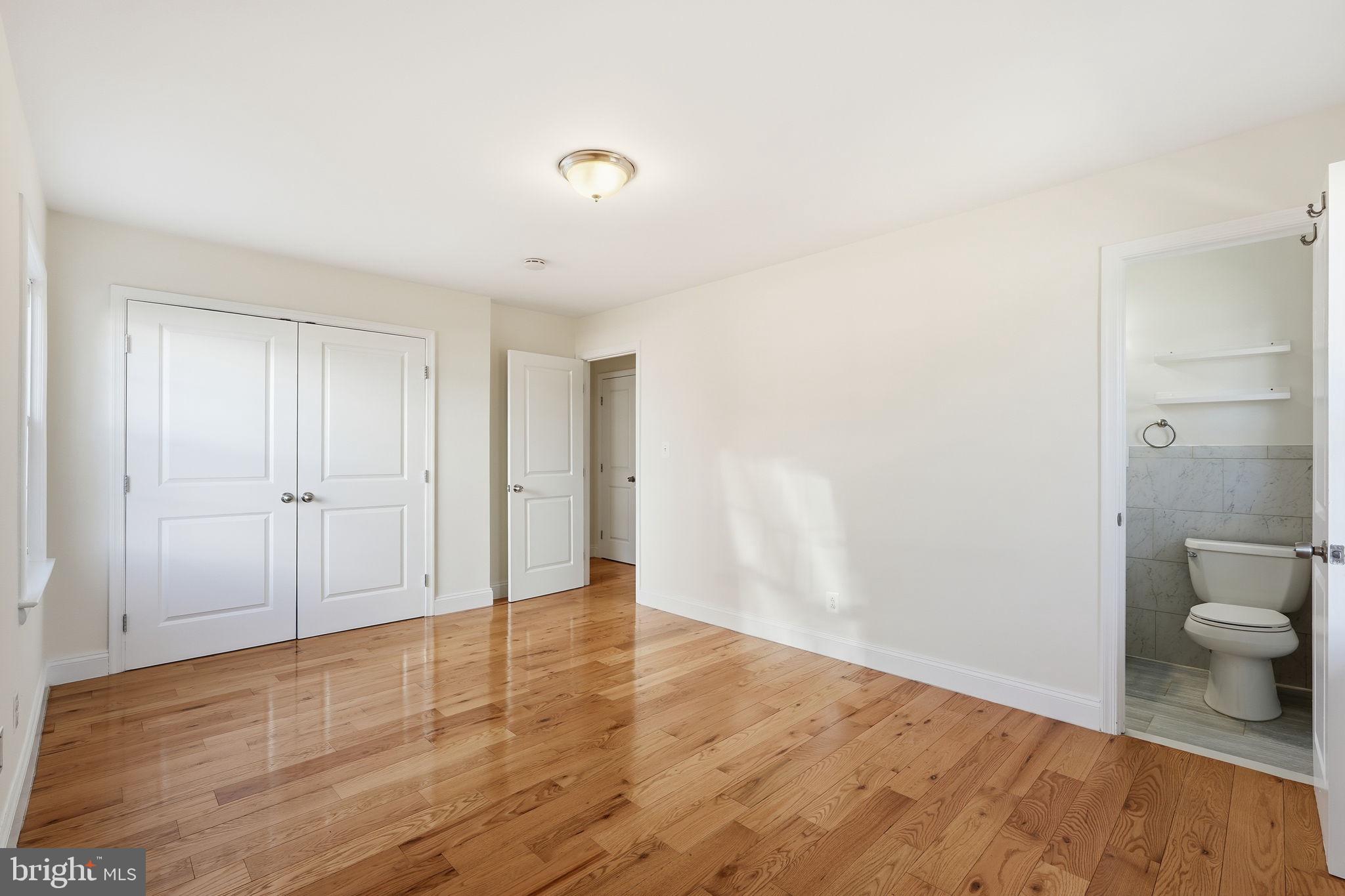9708 Dameron Drive Silver Spring, MD 20910 - Photo 15 of 38 a view of a room with wooden floor and shower