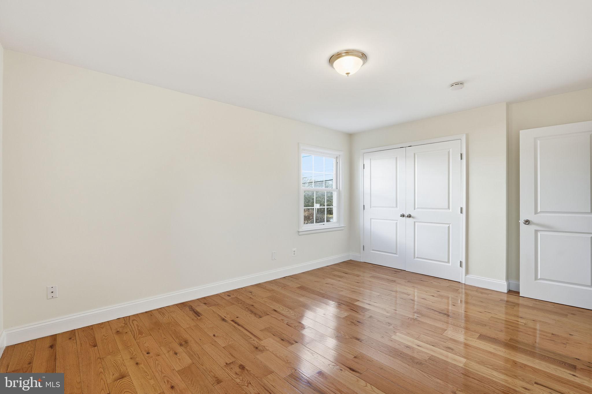 9708 Dameron Drive Silver Spring, MD 20910 - Photo 16 of 38 a view of empty room with wooden floor and fan