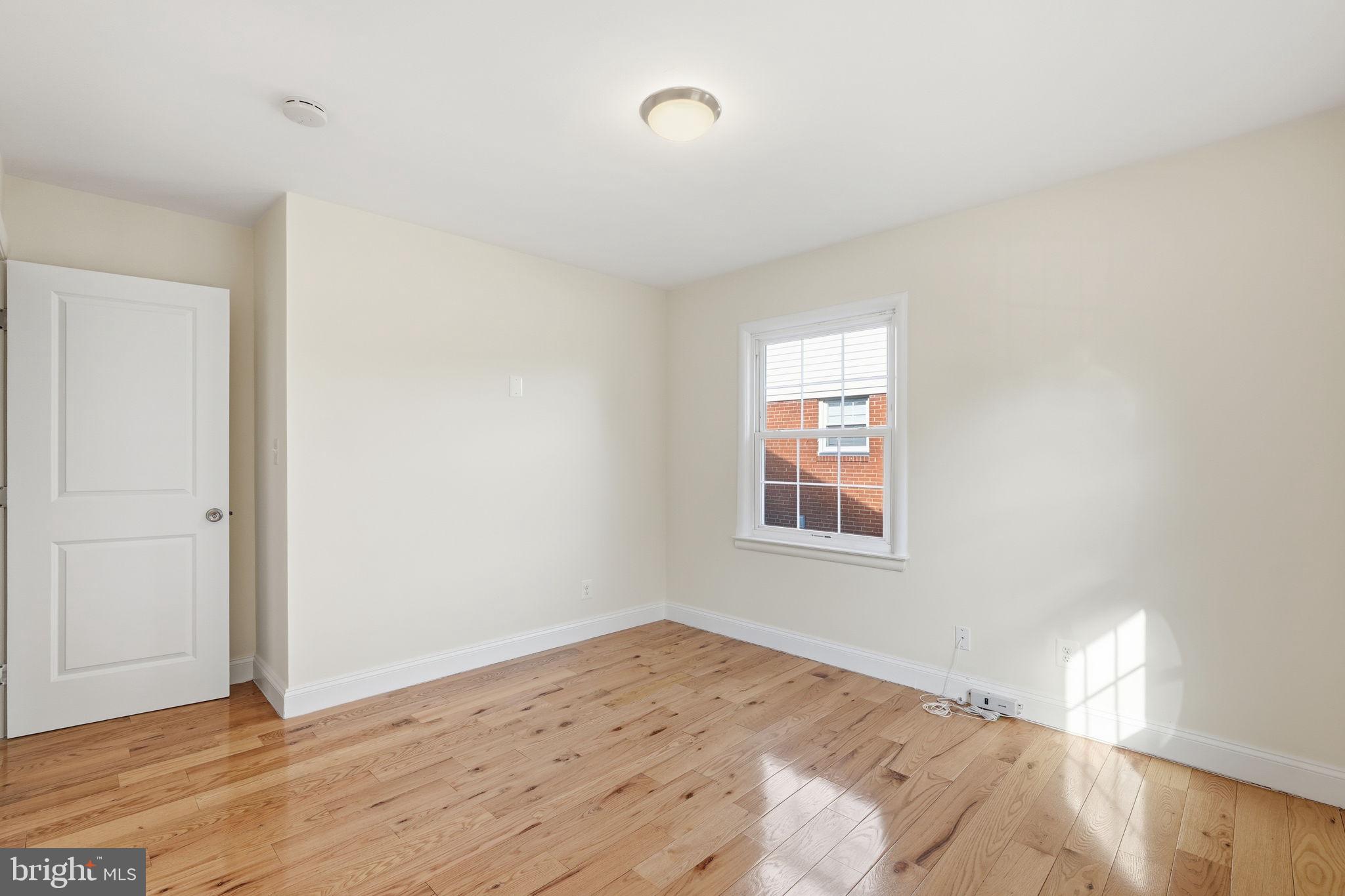 9708 Dameron Drive Silver Spring, MD 20910 - Photo 24 of 38 a view of a big room with wooden floor and windows