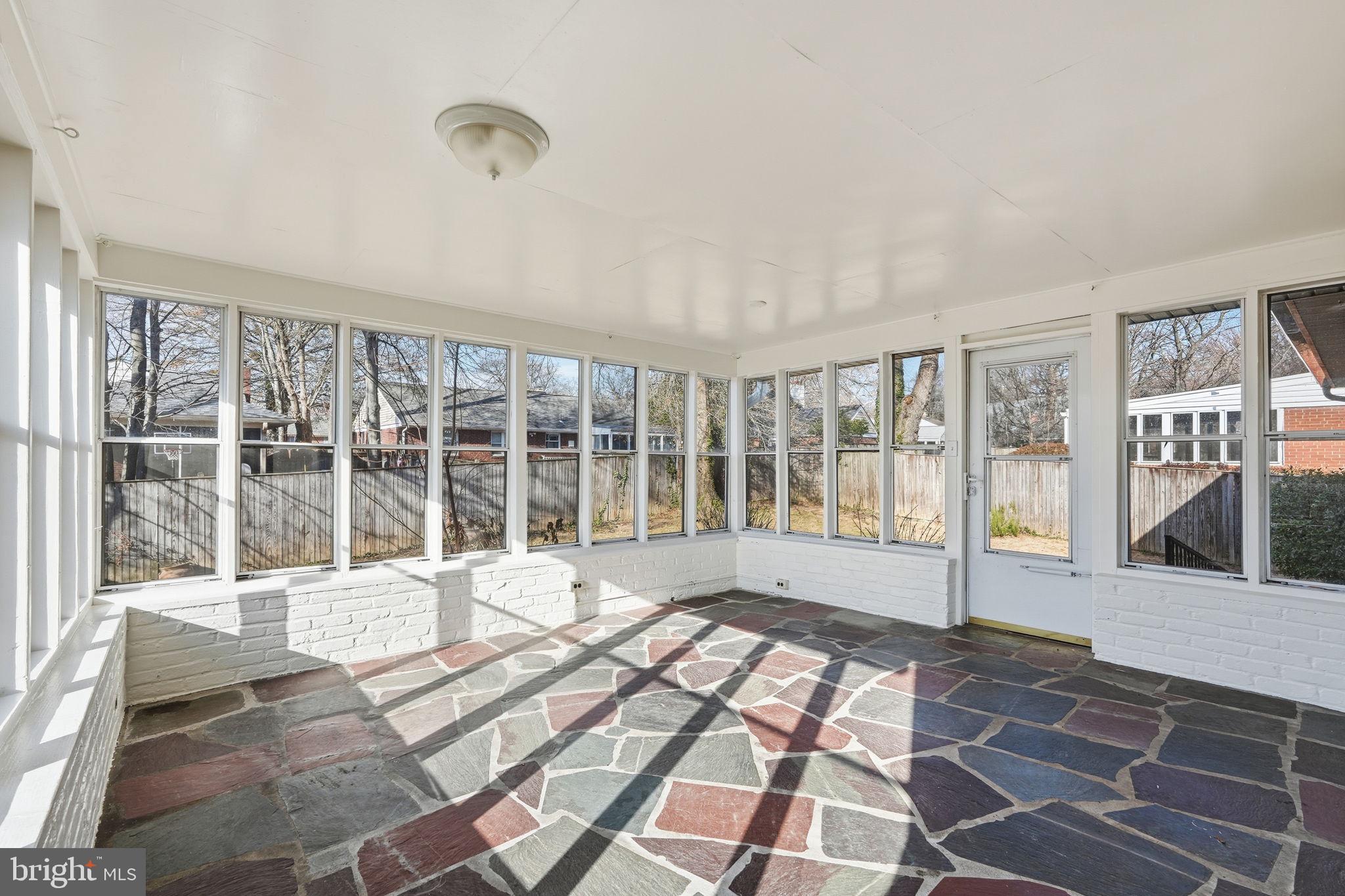 9708 Dameron Drive Silver Spring, MD 20910 - Photo 34 of 38 a view of a large white building with a glass door