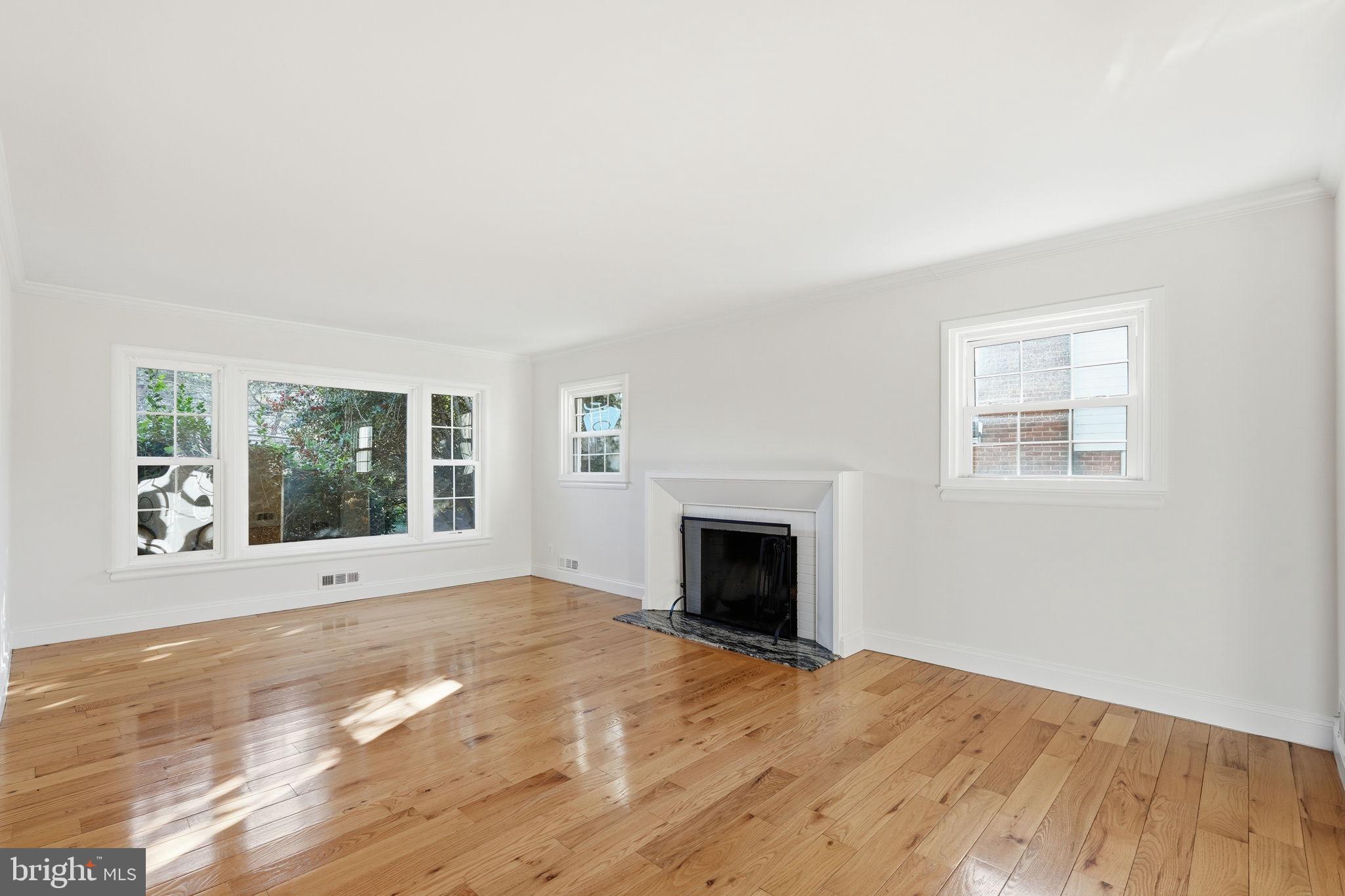 9708 Dameron Drive Silver Spring, MD 20910 - Photo 6 of 38 a view of empty room with wooden floor and fan