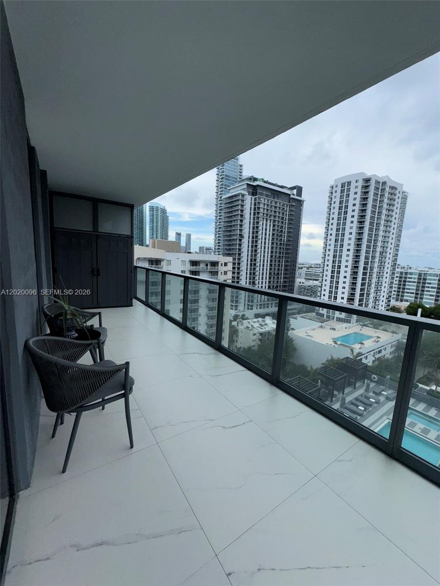 788 Northeast 23rd Street, Unit 1202 Miami, FL 33137 - Photo 39 of 64 a view of a hallway with seating area