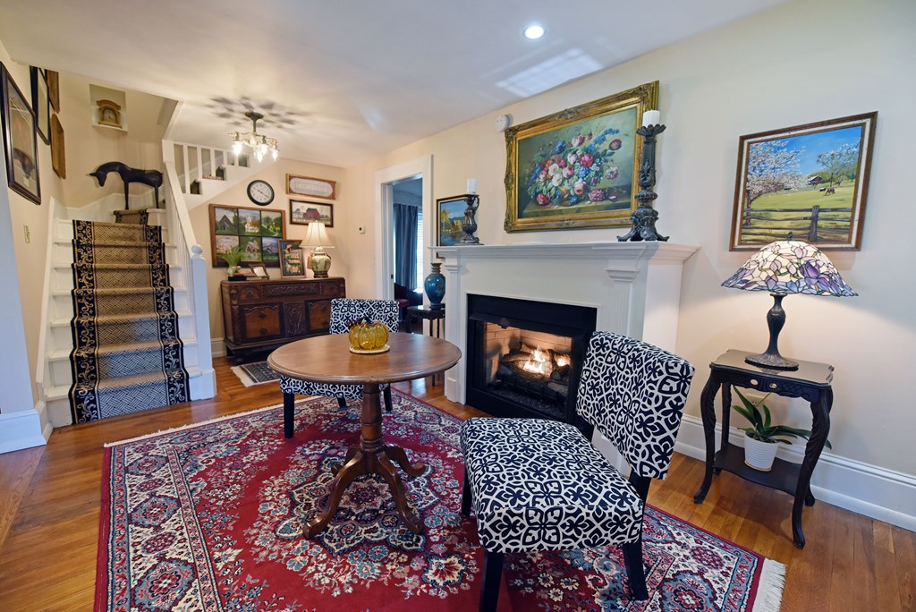 63 Loving Road Morganton, GA 30560 - Photo 18 of 58 a living room with furniture a rug and a fireplace