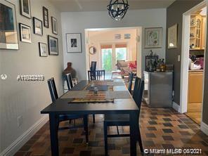8926 Emerson Avenue Surfside, FL 33154 - Photo 6 of 18 a dining room with furniture and window