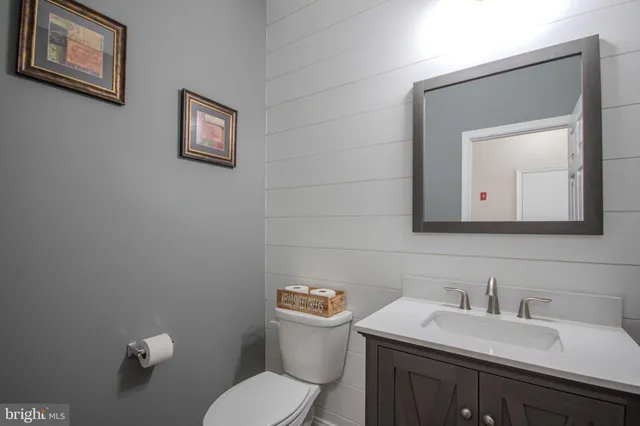 a view of a livingroom with furniture and a floor to ceiling window