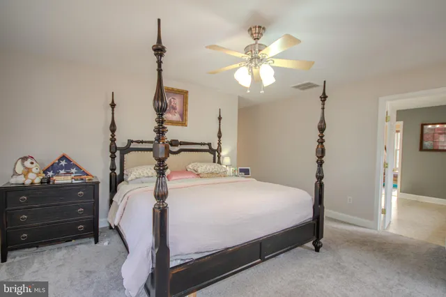 a spacious bathroom with a tub sink shower and mirror