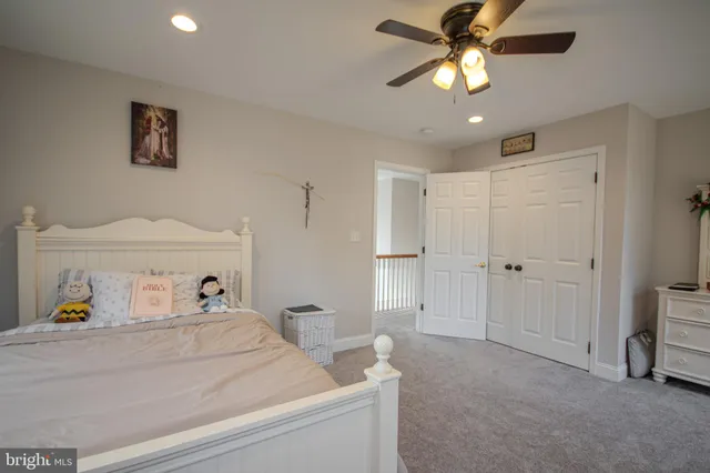 a spacious bedroom with a bed and furniture