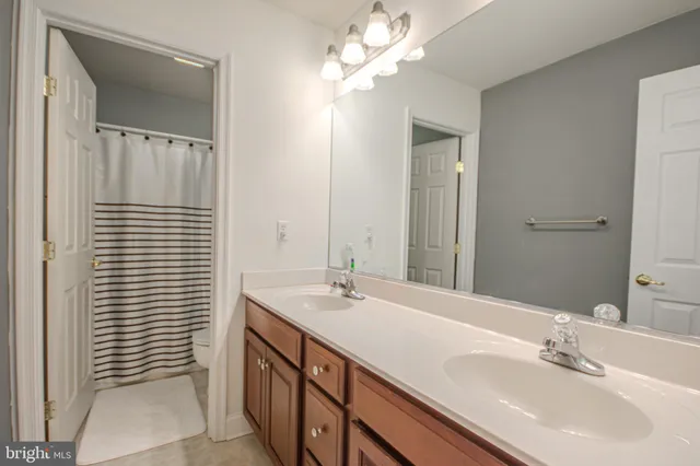 a bedroom with a bed and a tv