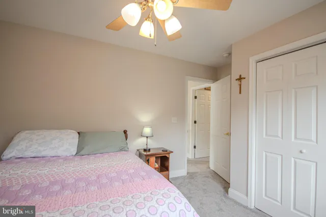 a bedroom with a bed and a television