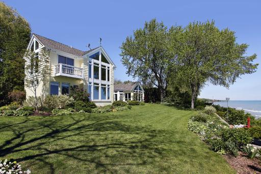 321 Willow Road Winnetka, IL 60093 - Photo 1 of 1 a front view of a house with a garden