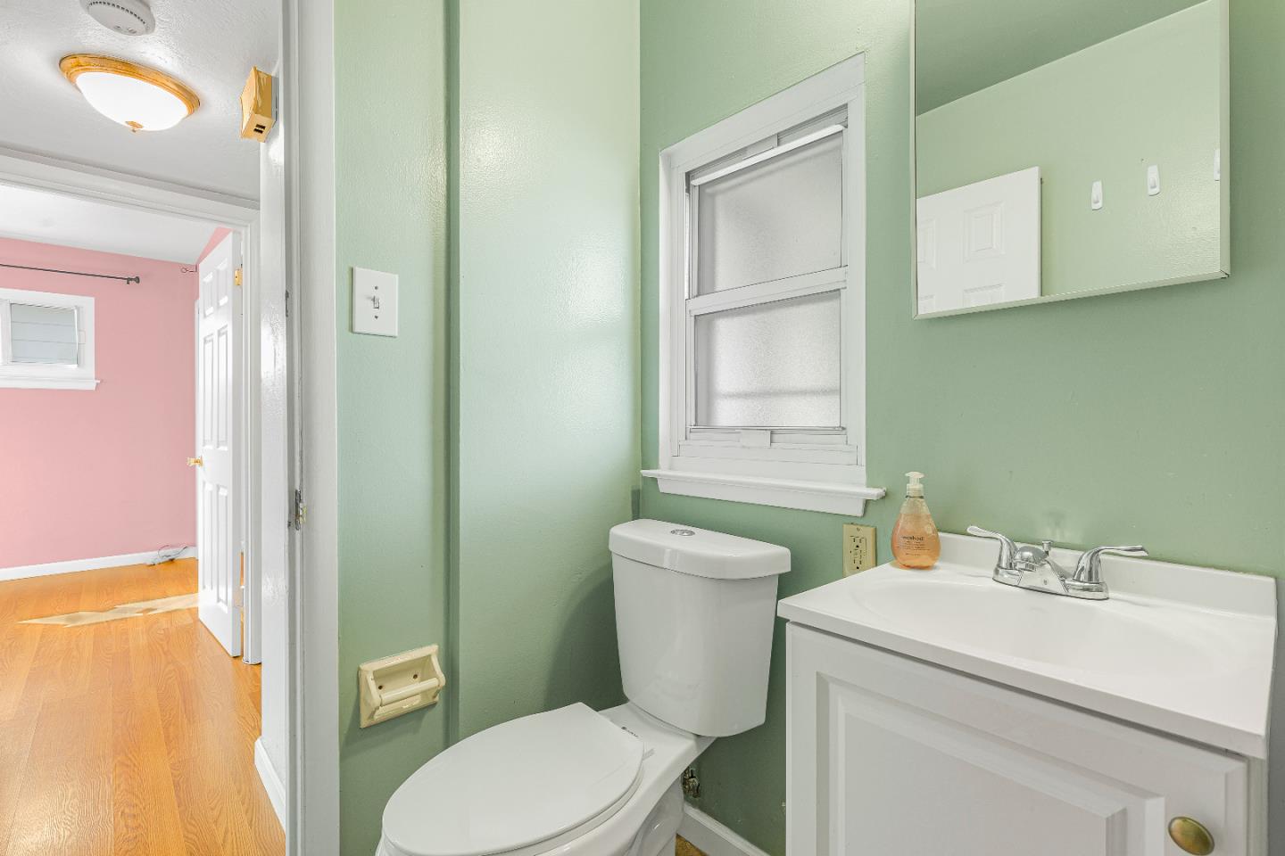 353 Cedar Street Millbrae, CA 94030 - Photo 16 of 19 a white toilet sitting next to a bathroom sink
