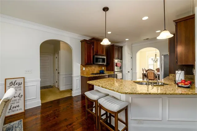 a kitchen with a table and chairs in it