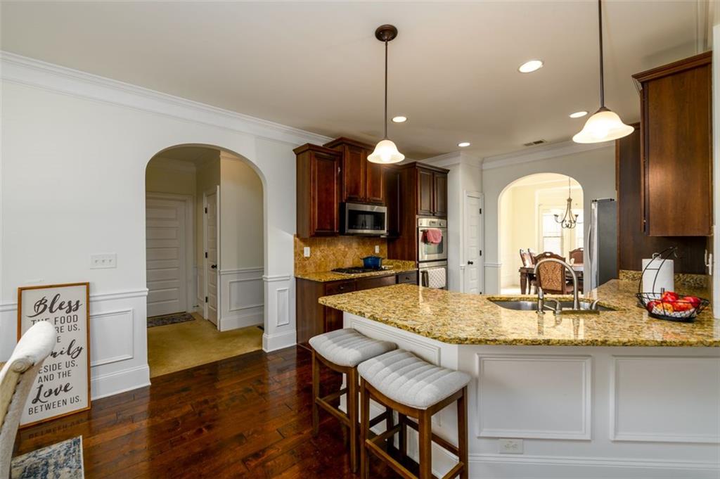 1979 Trinity Mill Drive Dacula, GA 30019 - Photo 14 of 38 a kitchen with a table and chairs in it