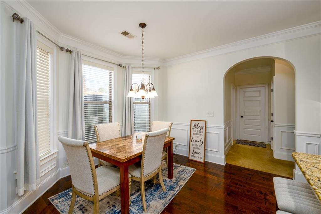 1979 Trinity Mill Drive Dacula, GA 30019 - Photo 15 of 38 a view of a dining room with furniture window and wooden floor