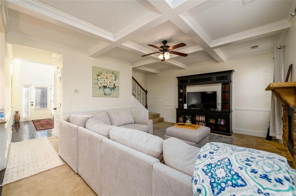 1979 Trinity Mill Drive Dacula, GA 30019 - Photo 17 of 38 a living room with furniture and a flat screen tv