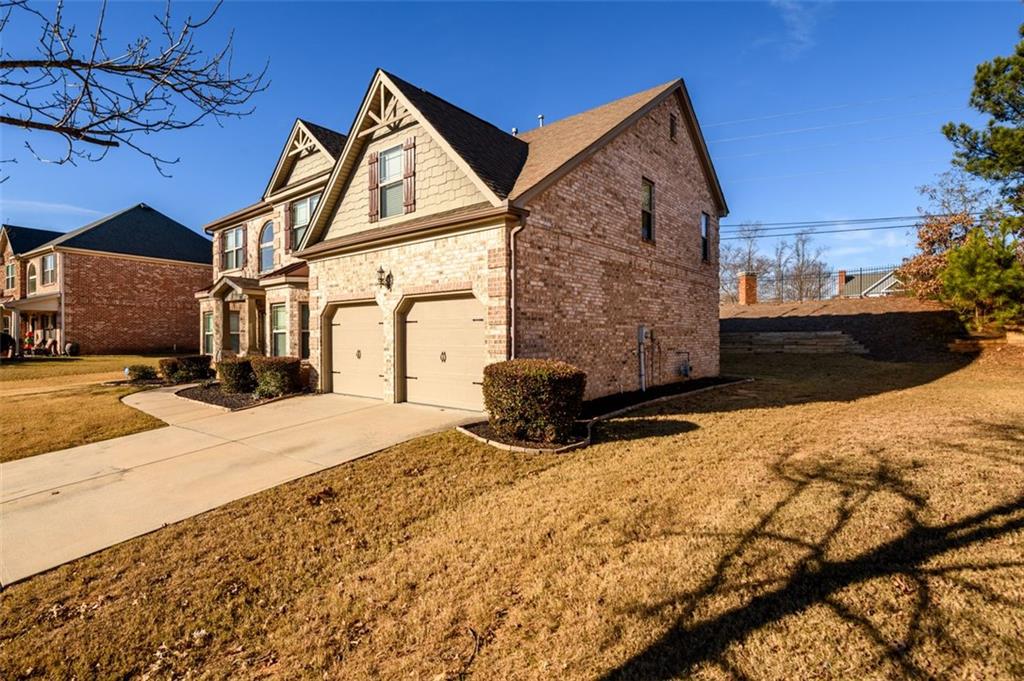 1979 Trinity Mill Drive Dacula, GA 30019 - Photo 2 of 38 a view of a house with snow on the road