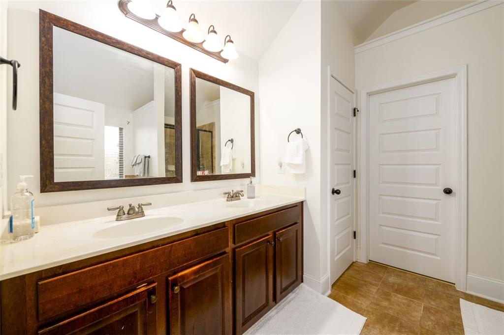 1979 Trinity Mill Drive Dacula, GA 30019 - Photo 23 of 38 a spacious bathroom with a sink double vanity and a mirror